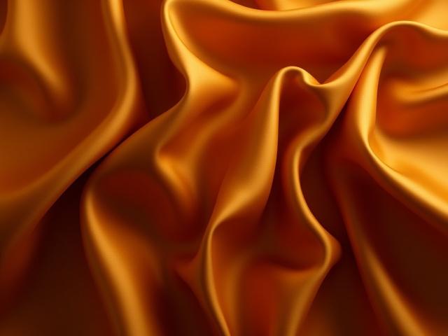 Tessuto lussuoso drappeggiato con eleganza, in tonalità calde